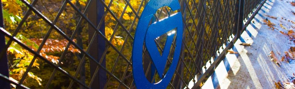 Circle GVSU logo on a fence